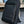 Slim Pack Rucksack von SPARTANHUB stehend vor einem Tisch – minimalistisches, elegantes Design für Beruf und Alltag.