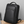 Slim Pack Rucksack von SPARTANHUB stehend auf einem Schreibtisch – minimalistisches, elegantes Design für Beruf und Alltag.